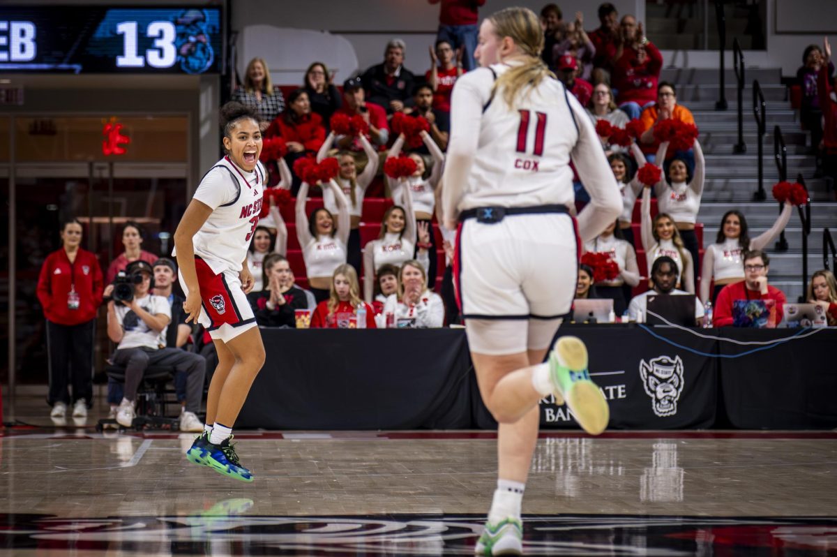 Sophomore guard Zamareya Jones yells in celebration in the direction of junior forward Maddie Cox after a made basket during the game against Coastal Carolina in Reynolds Coliseum on Wednesday, Nov. 19, 2025. The Wolfpack defeated the Chanticleers 71-58.