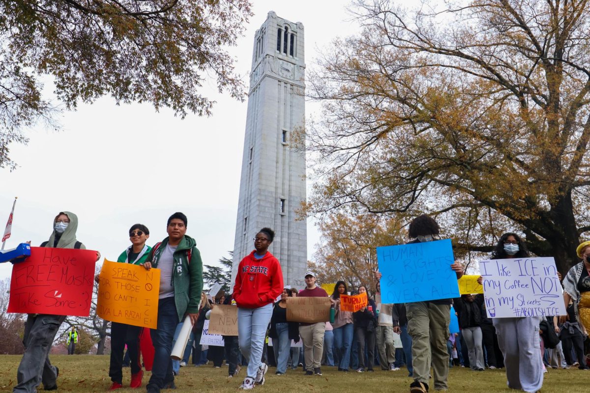 Students and faculty march during the "NC State Stands with Immigrants" Protest at the Belltower on Friday, Nov. 21, 2025. This protest was hosted by various Latinx organizations in order to protest ICE.