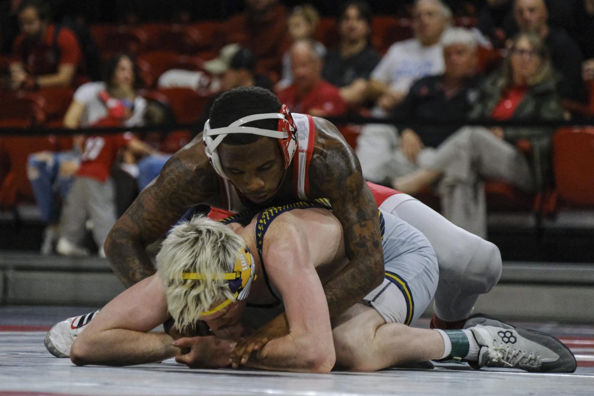 Redshirt Sophomore Vincent Robinson pins his opponent during the duel against the of Northern Colorado in Reynolds Coliseum on Saturday, Nov. 8th, 2025. Robinson won the 125 bout 13-3. NC State defeated Northern Colorado 30-3.