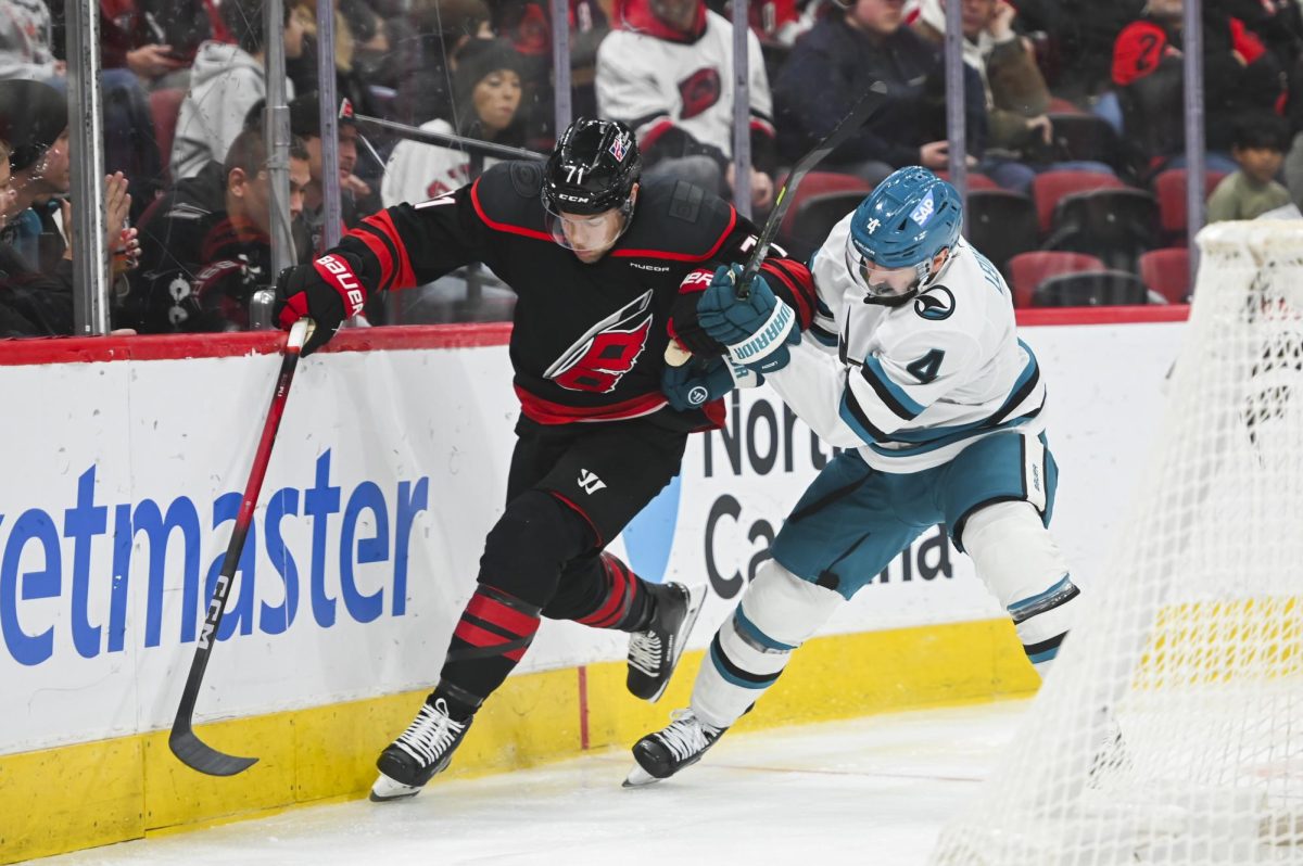 Left wing Taylor Hall battles an opponent during the game versus the San Jose Sharks at the Lenovo Center on Sunday, Dec. 7, 2025. The Hurricanes lost 4-1 to the Sharks.