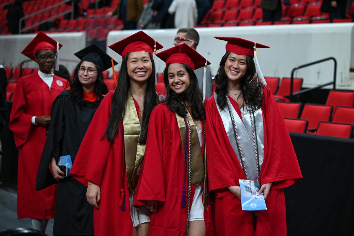 Graduates Sarah Chen, studying biology, Sithara Griffin, studying biology, and Kalea Davis, studying biomedical engineering, pose during the Fall Commencement Ceremony in the Lenovo Center on Saturday, Dec. 13, 2025.