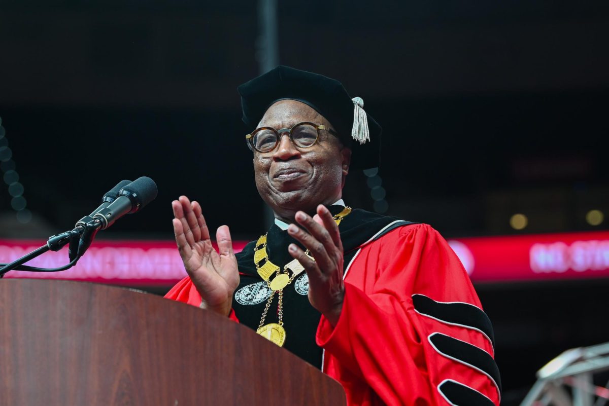 Chancellor Kevin Howell claps to congratulate the class of 2025 during the Fall Commencement Ceremony in the Lenovo Center on Saturday, Dec. 13, 2025. The Fall Commencement awarded 3,498 degrees to 3,384 graduates.