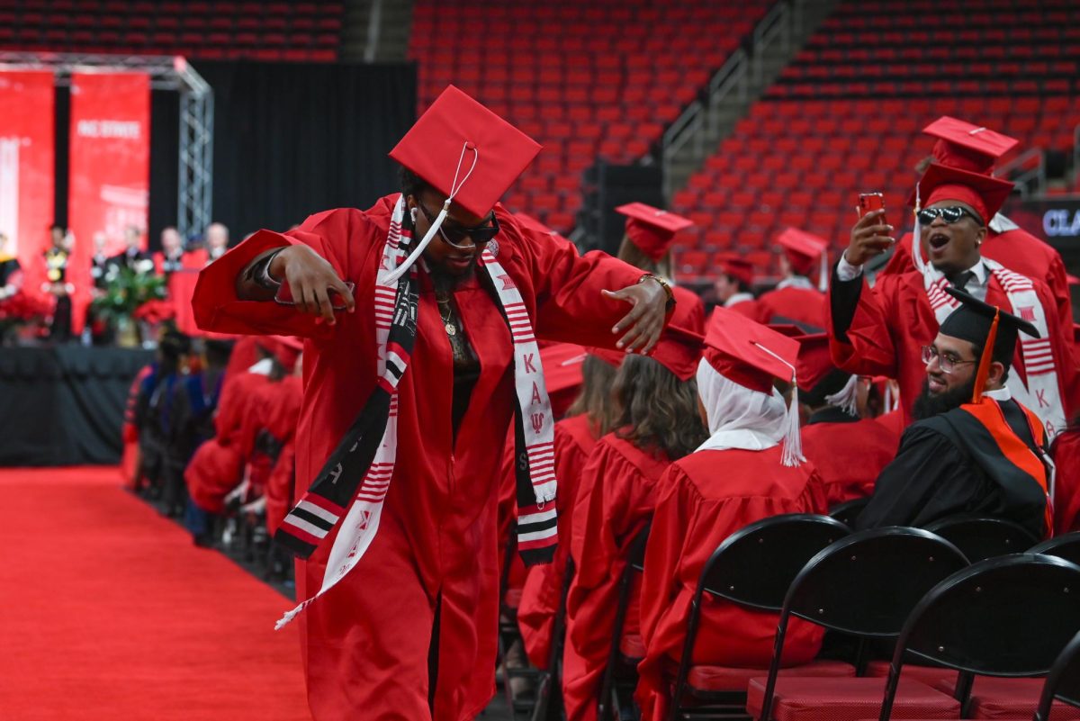 Zaire Kenney, a fourth-year studying business administration and a brother of the Kappa Xi chapter of Kappa Alpha Psi Fraternity, strolls in celebration during the Fall Commencement Ceremony in the Lenovo Center on Saturday, Dec. 13, 2025. The Fall Commencement awarded 3,498 degrees to 3,384 graduates.