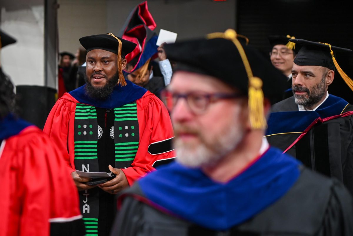 Higher-Education graduates walk into the Fall Commencement ceremony in the Lenovo Center on Saturday, Dec. 13, 2025. The Fall Commencement honors both summer and fall 2025 graduates.
