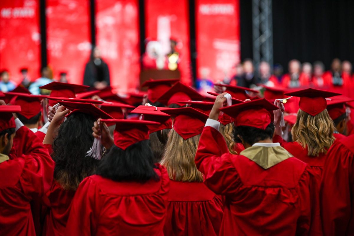 Newly graduated students turn their tassels during the Fall Commencement Ceremony in the Lenovo Center on Saturday, Dec. 13, 2025. The turning of the tassels was led by student commencement speaker, Urwa Rashid, a graduate majoring in psychology.