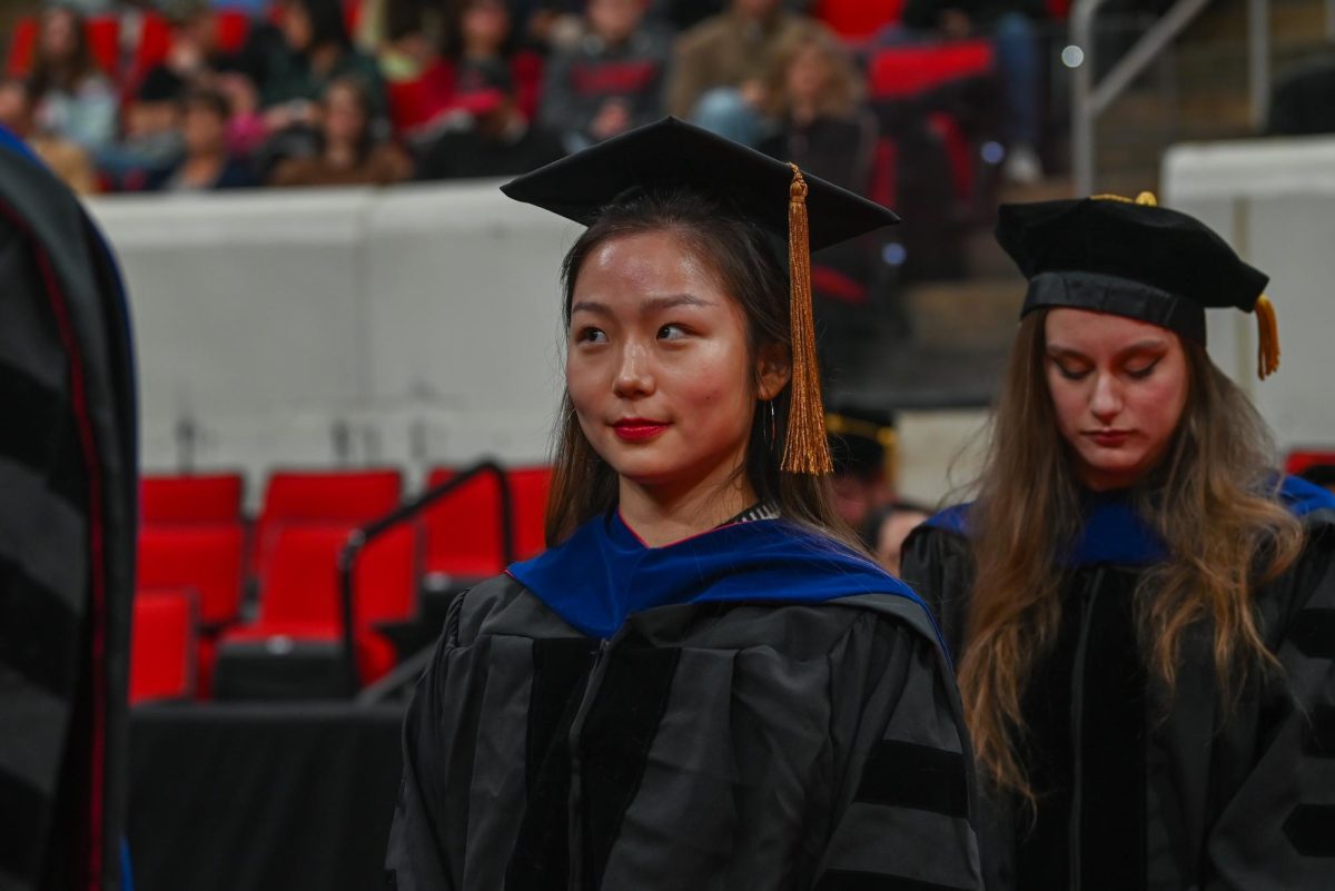 Yang Xu, a graduate receiving her doctor of philosophy degree in statistics, eagerly awaits her turn to walk on stage in the Lenovo Center on Saturday, Dec. 13, 2025 during the Fall Commencement. The Fall Commencement awarded 3,498 degrees to 3,384 graduates.