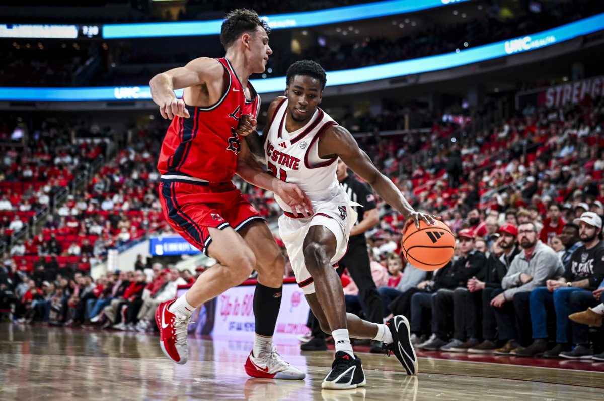 Redshirt junior guard Terrance Arceneaux attempts to drive to the basket during the game against Liberty at Lenovo Center on Wednesday, Dec. 10, 2025. Arceneaux scored eight points. NC State beat Liberty 85-45.