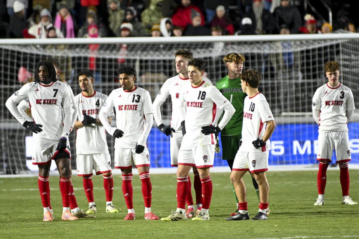 The NC State men's soccer team waits for the referee during the Men's College Cup Championship game against Washington at First Horizon Stadium on Monday, Dec. 15, 2025. The game ending goal was put under review. The Wolfpack lost to the Huskies 3-2 after going into overtime.