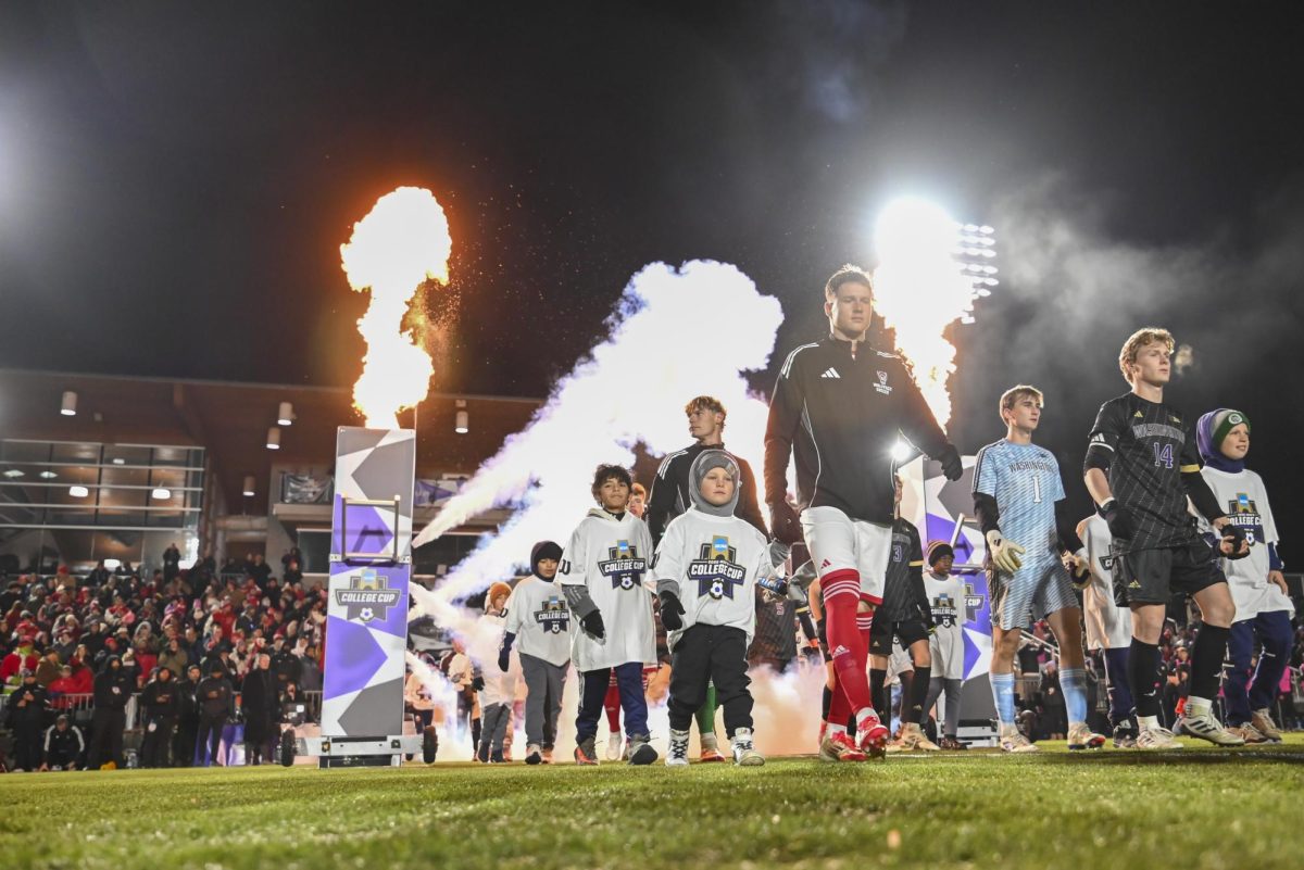 NC State and the University of Washington men's soccer team walks onto the field during the College Cup Championship game at First Horizon Stadium on Monday, Dec. 15, 2025. This was the first time in program history that the NC State men's soccer team played in the NCAA College Cup Championship game The Wolfpack lost to the Huskies 3-2 after going into overtime.