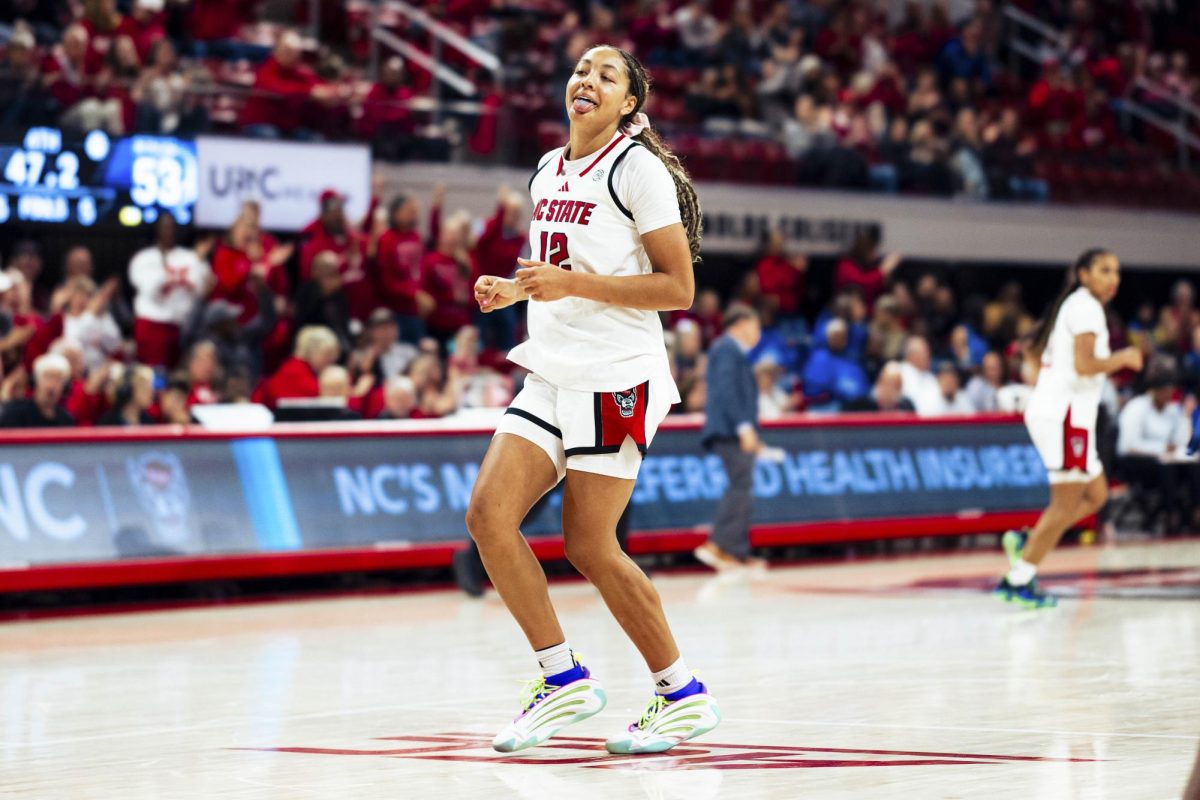 Junior forward Khamil Pierre sticks her tongue out after making a shot during the game against Seton Hall in Reynolds Coliseum on Sunday, Dec. 7, 2025. Pierre scored 11 points. The Wolfpack defeated the Pirates 61-53.