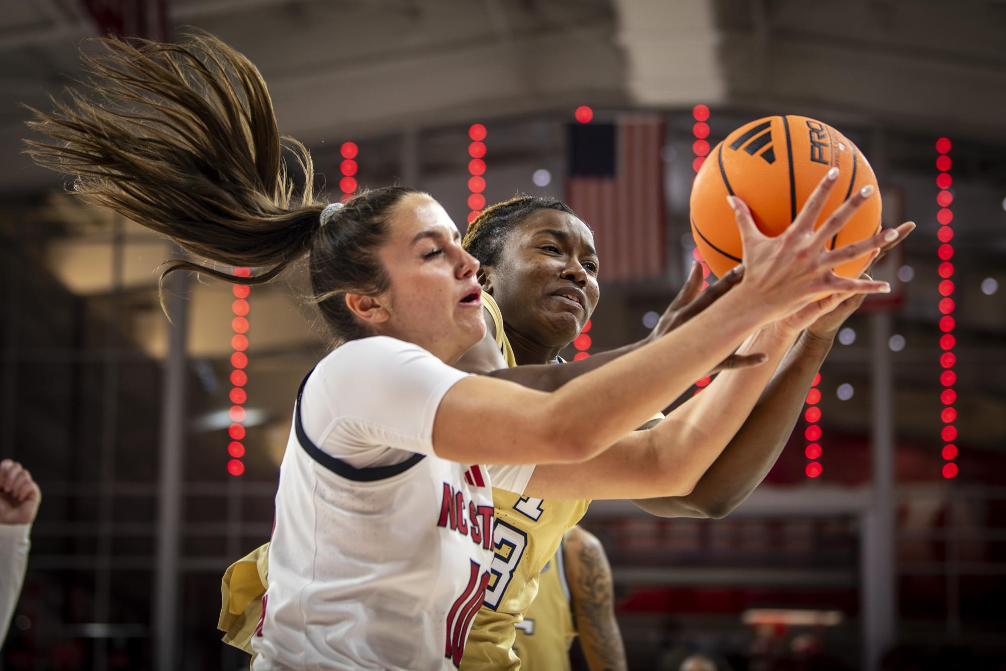 Freshman guard Adelaide Jernigan fights for possession during the game against Georgia Tech at Reynolds Coliseum on Thursday, Dec. 18, 2025. The Wolfpack defeated the Yellow Jackets 87-58.