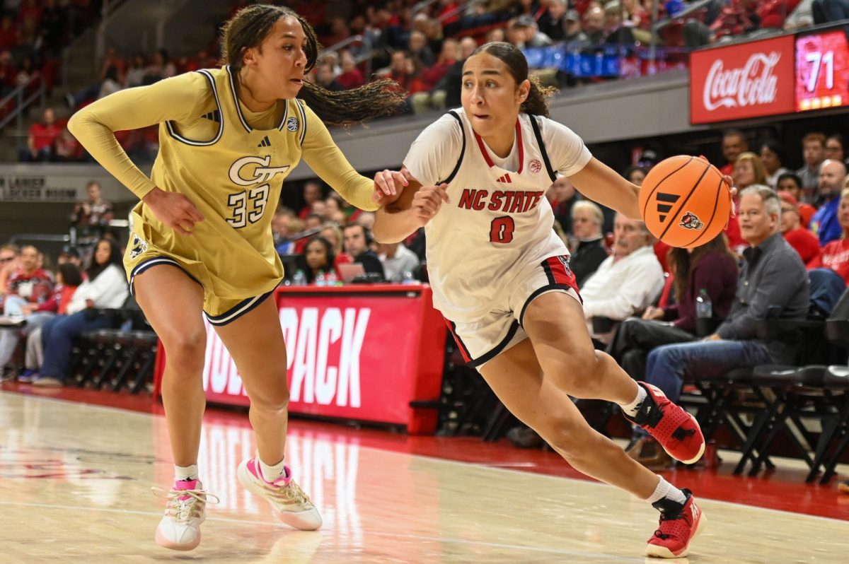 Sophomore guard Devyn Quigley dribbles the ball during the game against Georgia Tech at Reynolds Coliseum on Thursday, Dec. 18, 2025. The Wolfpack defeated the Yellow Jackets 87-58.