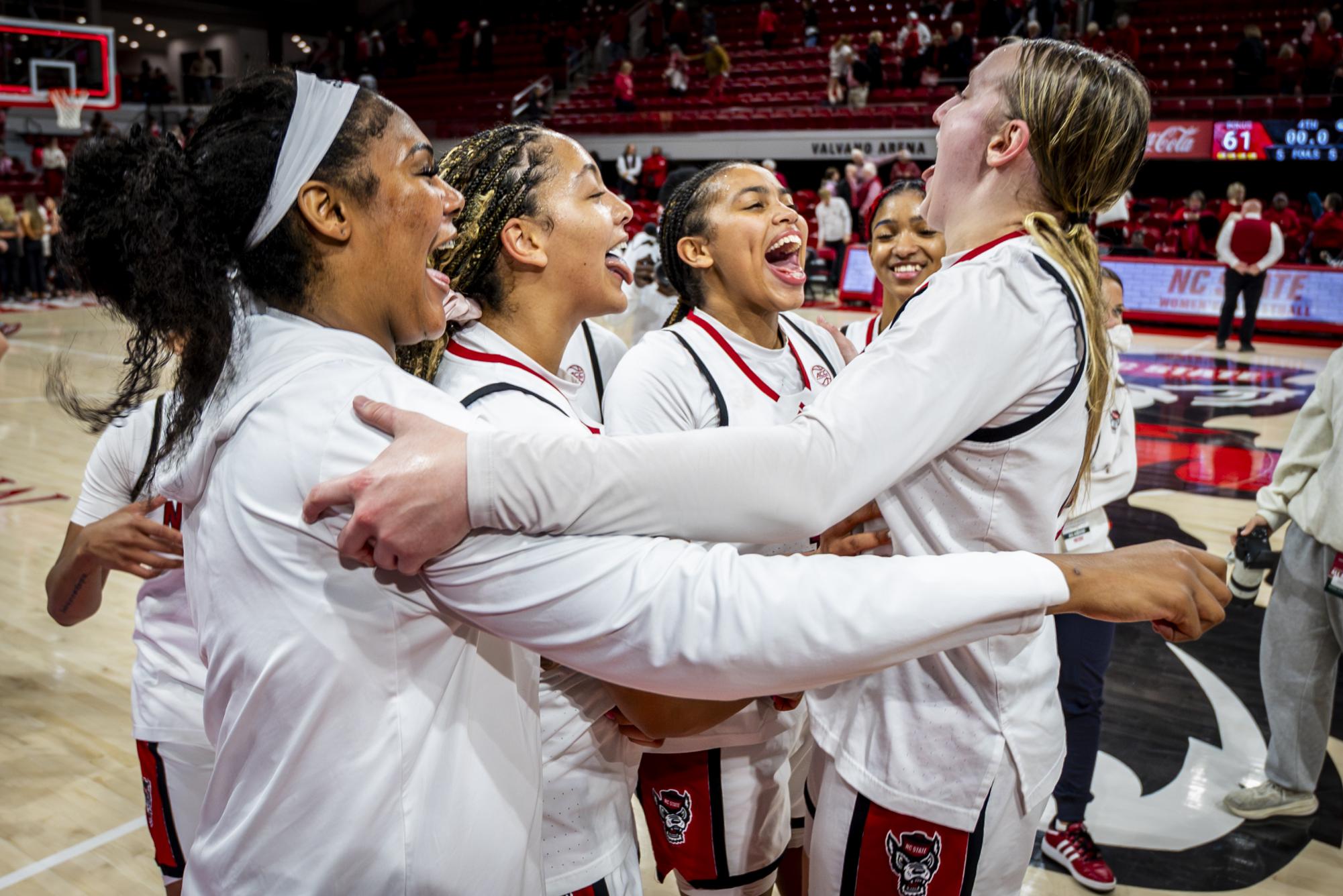 The NC State women's basketball celebrates after the game against Seton Hall in Reynolds Coliseum on Sunday, Dec. 7, 2025. The Wolfpack defeated the Pirates 61-53.