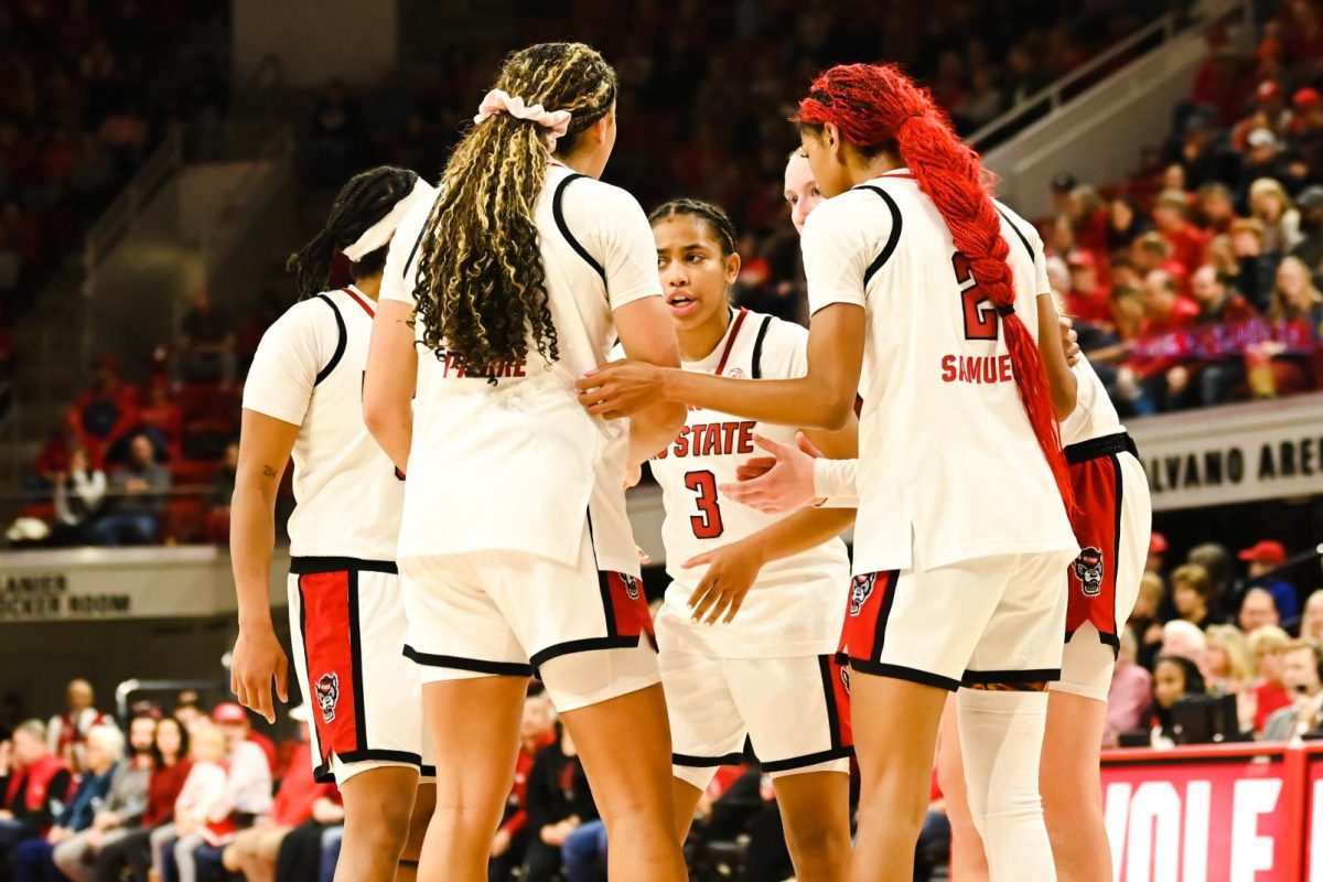 NC State players huddle together during the game against Seton Hall in Reynolds Coliseum on Sunday, Dec. 7, 2025. The Wolfpack defeated the Pirates 61-53.