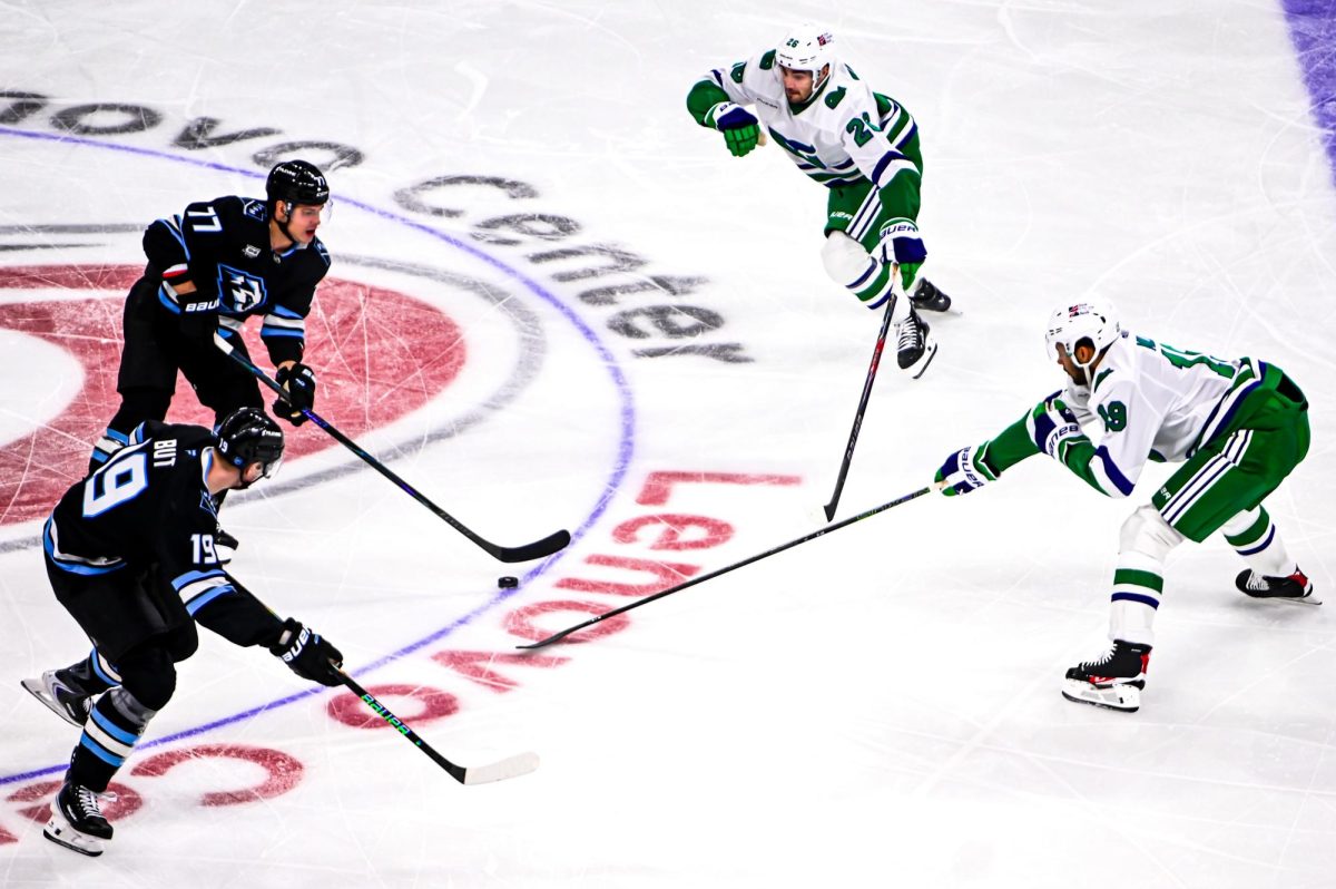 Defensemen Sean Walker and K’Andre Miller chase after the puck during the game versus the Utah Mammoth at the Lenovo Center on Thursday, Jan. 29, 2026. Both Walker and Miller had two hits. The Canes beat the Mammoth 5-4.  