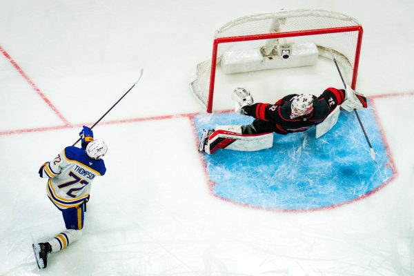 Goalie Brandon Bussi makes a save during the game versus the Buffalo Sabres at the Lenovo Center on Monday, Jan. 19, 2026.  Bussi recorded 17 saves. The Canes beat the Sabres 2-1.