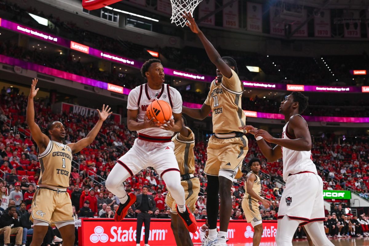 Senior guard Quadir Copeland defends a lay-up during the game against Georgia Tech at the Lenovo Center on Saturday, Jan. 17, 2026. Copeland scored a total of 16 points. The Wolfpack fell to the Yellow Jackets 74-78.