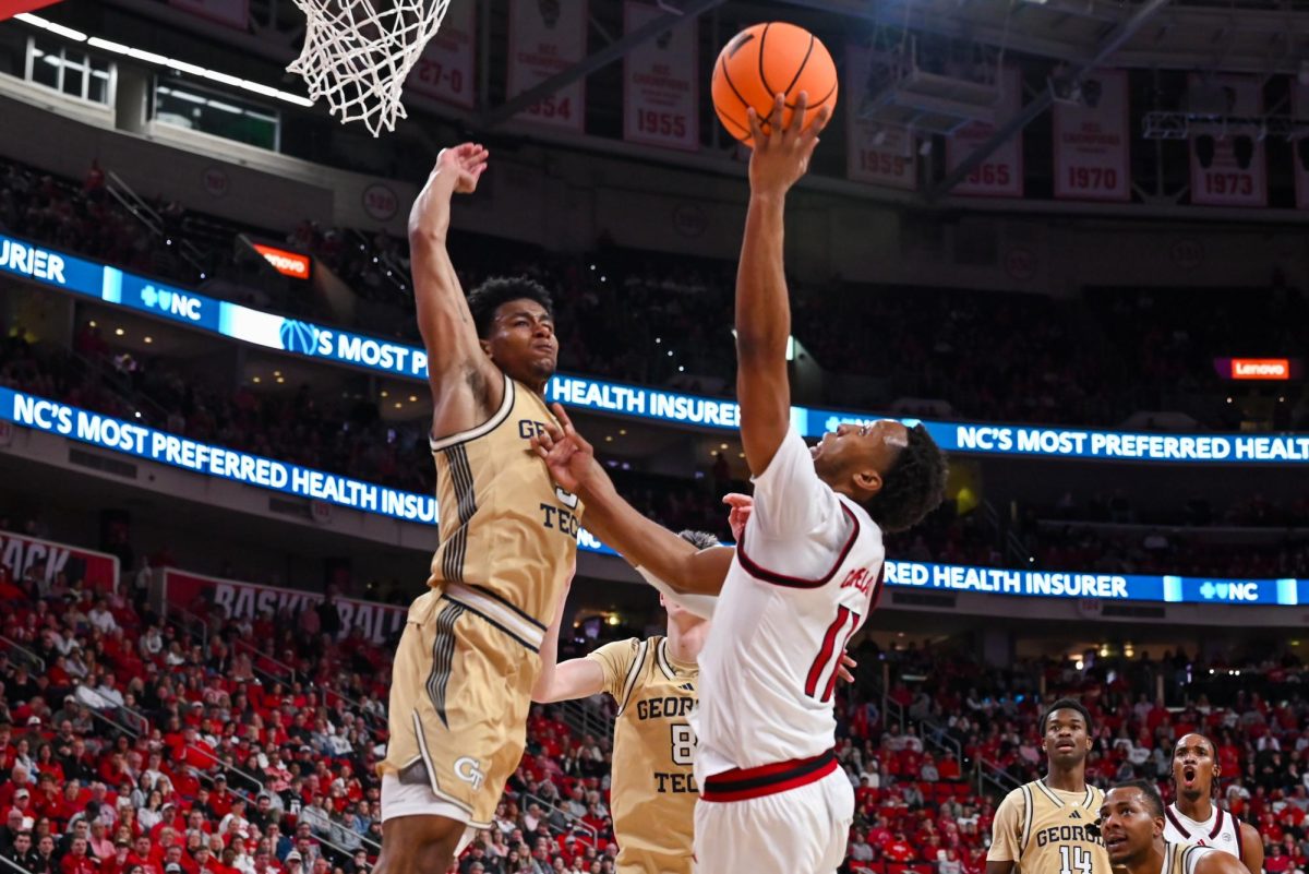 Senior guard Quadir Copeland puts up a defended shot at the Lenovo Center during the game against Georgia Tech on Saturday Jan. 17, 2026. Copeland had a total of six rebounds and six assists. The Wolfpack fell to the Yellow Jackets 74-78.