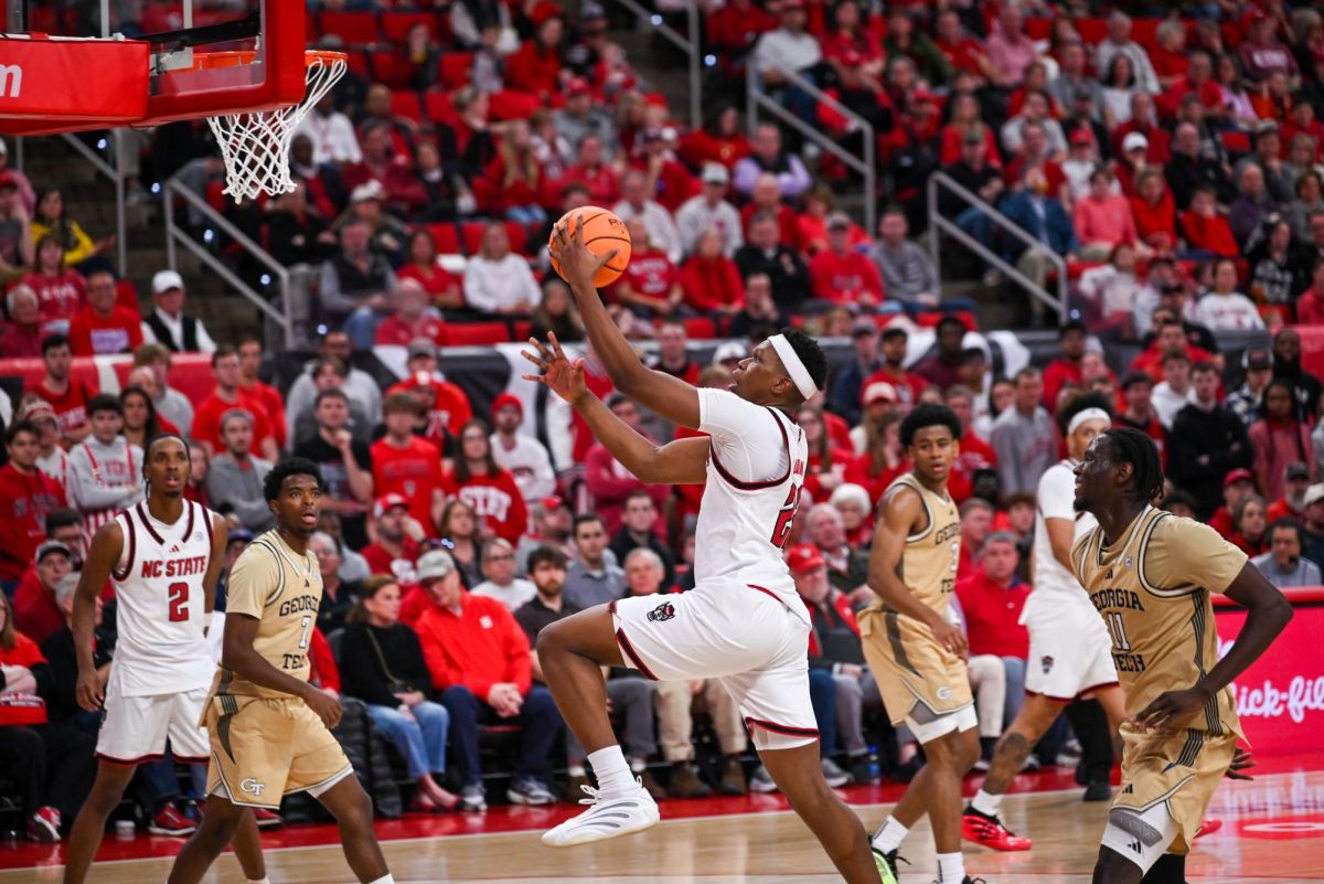 Senior forward Ven-Allen Lubin jumps towards the net for a layup at the Lenovo Center during the game against Georgia Tech on Saturday Jan. 17, 2026. Lubin scored a total of 12 points. The Wolfpack fell to the Yellow Jackets 74-78.