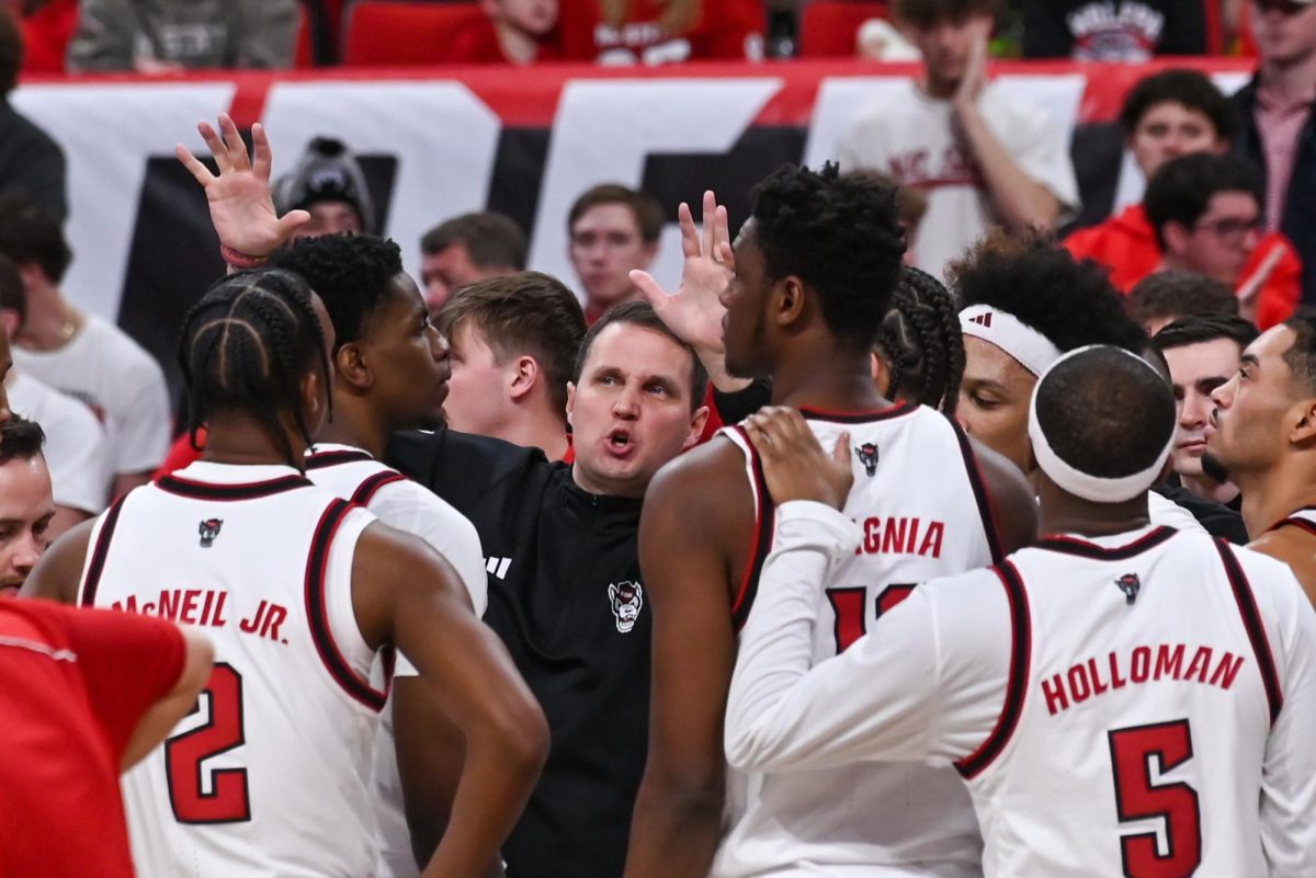 Head Coach Will Wade coordinates with the team during a timeout during the game against Georgia Tech at the Lenovo Center on Saturday Jan. 17, 2026. NC State had a total of 32 rebounds and 13 steals. The Wolfpack fell to the Yellow Jackets 74-78.