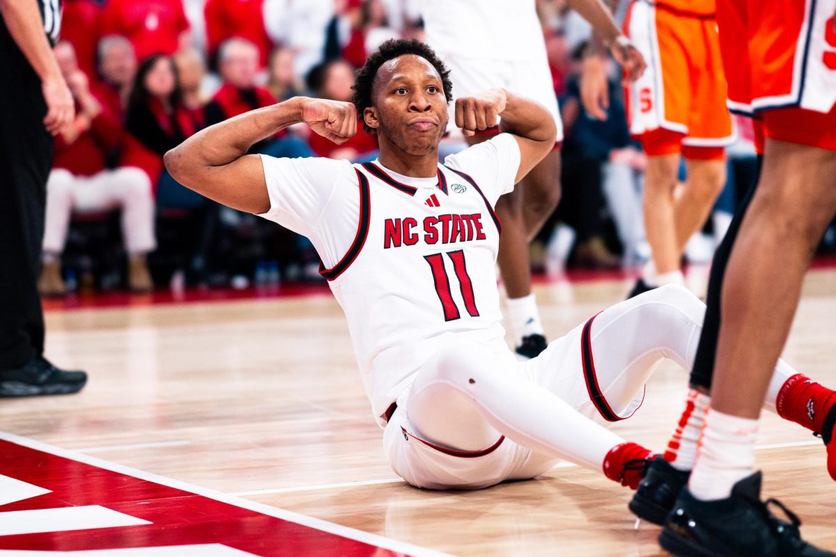 Senior guard Quadir Copeland flexes after making a layup and drawing an and-one free throw opportunity during the game against Syracuse in the Lenovo Center on Tuesday, Jan. 27, 2026. Copeland scored 19 points. The Wolfpack defeated the Orange 88-68.