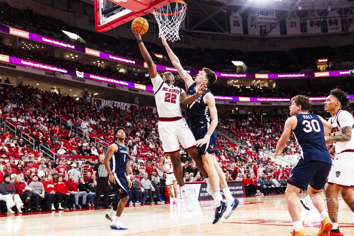 Senior forward Ven-Allen Lubin attempts a layup after driving to the basket during the game against Virginia at Lenovo Center on Saturday, Jan. 3, 2026. Lubin scored seven points. The Cavaliers beat the Wolfpack 76-61.