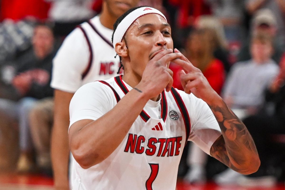 Senior forward Darrion Williams kisses his fingers after scoring a three-pointer during the game against Syracuse at the Lenovo Center on Tuesday, Jan. 27, 2026. Williams finished with 23 points and five three-pointers. The Wolfpack defeated the Orange 88-68. 