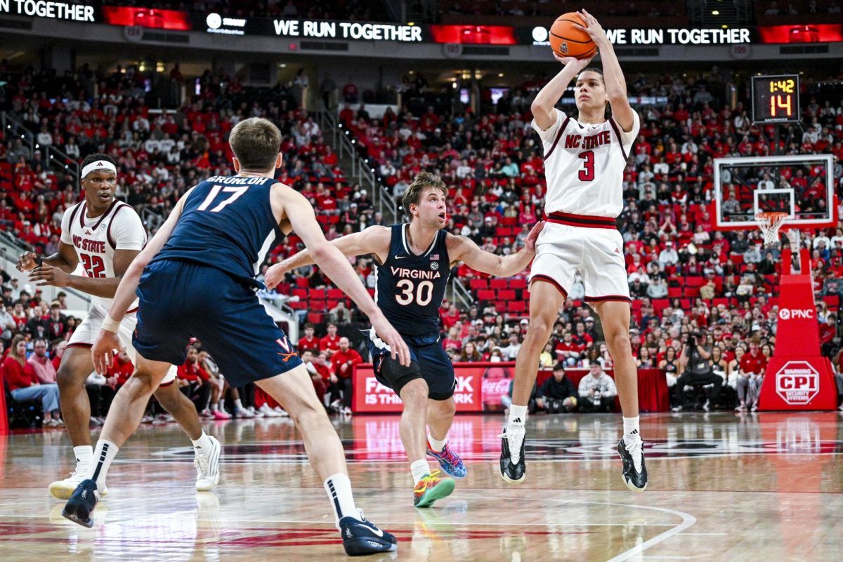 Freshman guard Matt Able shoots the ball during the game against Virginia at the Lenovo Center on Saturday, Jan. 3, 2026. Able scored five points. The Cavaliers beat the Wolfpack 76-61.