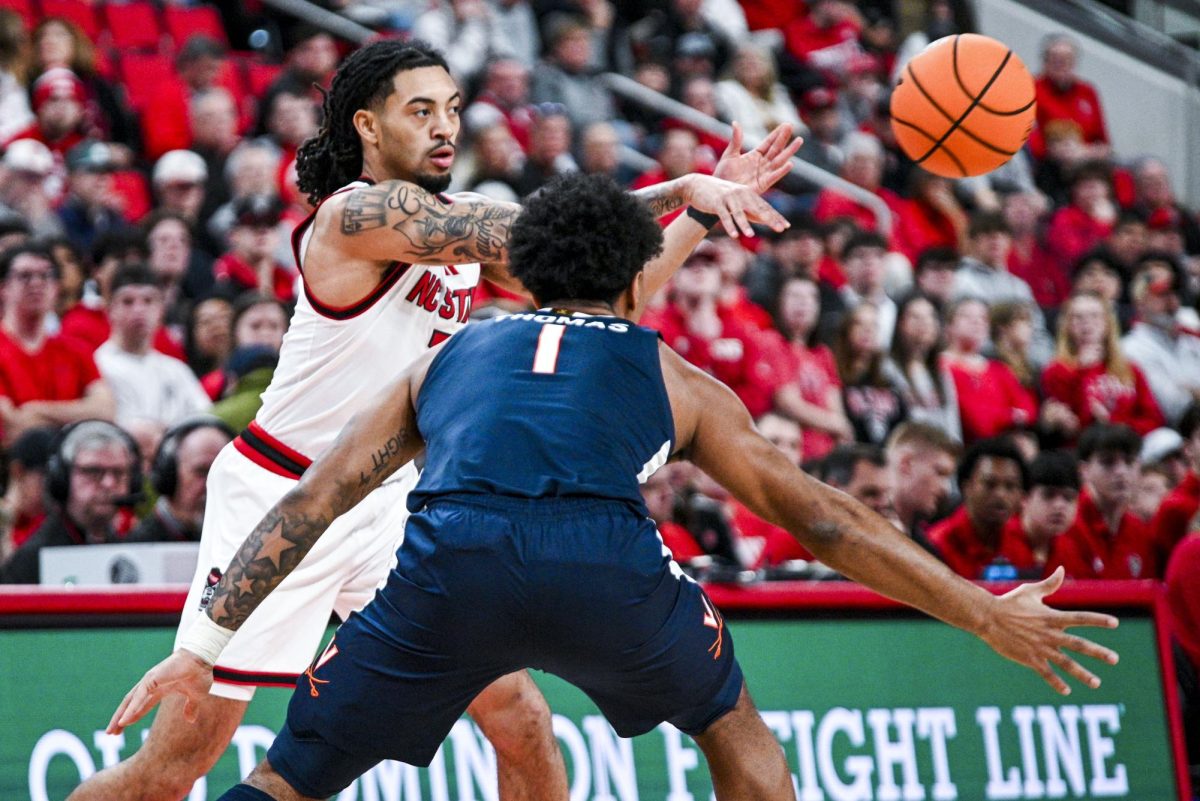 Senior guard Alyn Breed passes the ball during the game against Virginia at the Lenovo Center on Saturday, Jan. 3, 2026. Breed scored a total of 12 points. The Cavaliers beat the Wolfpack 76-61.