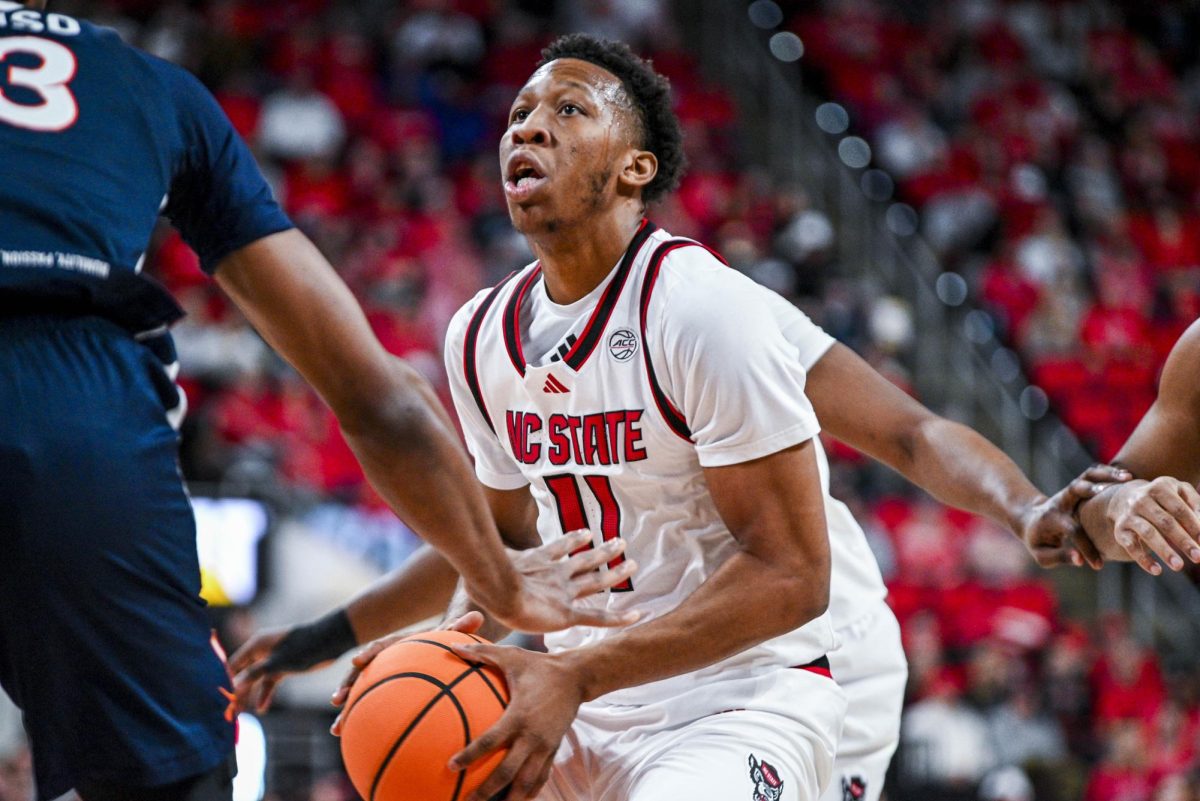 Senior guard Quadir Copeland shoots the ball during the game against Virginia at the Lenovo Center on Saturday, Jan. 3, 2026. Copeland scored a total of 15 points. The Cavaliers beat the Wolfpack 76-61.