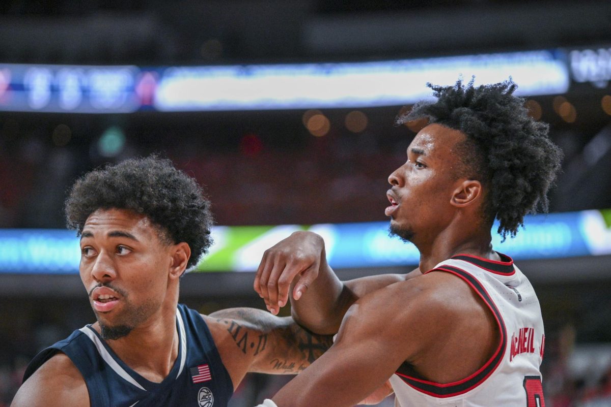 Sophomore guard Paul McNeil fights for position during the game against Virginia at the Lenovo Center on Saturday, Jan. 3, 2026. McNeil scored a total of 13 points. The Cavaliers beat the Wolfpack 76-61.