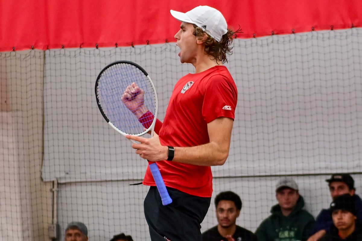 Senior Martin Borisiouk celebrates the point during the match against Duke at the J.W. Isenhour Tennis Center on Friday, Jan. 23, 2026. Borisiouk lost his singles match 2-6, 4-6. NC State fell to Duke 4-2.