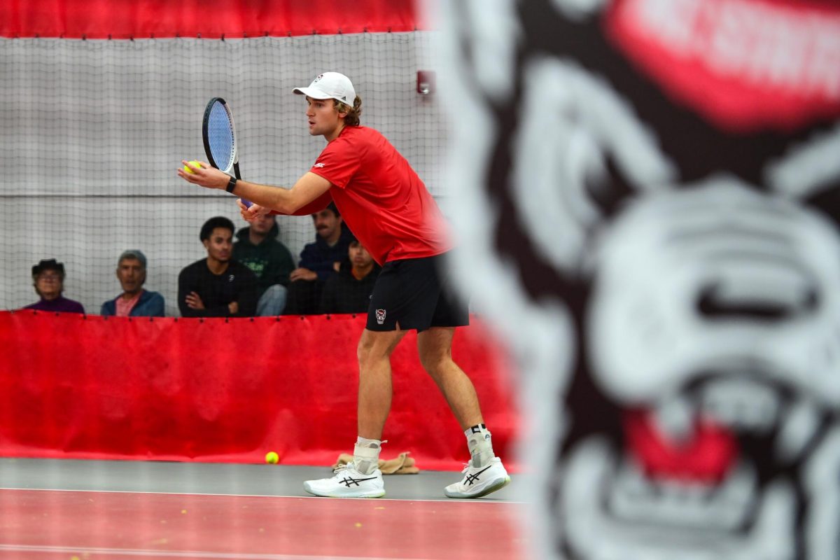 Senior Martin Borisiouk prepares to serve during his singles match against Duke at the J.W. Isenhour Tennis Center on Friday, Jan. 23, 2026. Borisiouk lost his singles match 2-6, 4-6.  NC State fell to Duke 2-4.