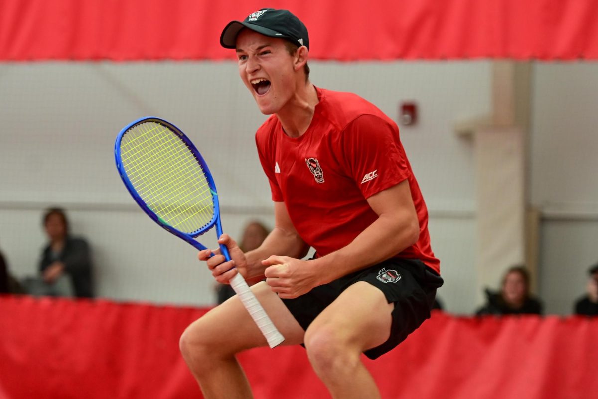Freshman Charlie Camus yells during his singles match against Duke at the J.W. Isenhour Tennis Center on Friday, Jan. 23, 2026. Camus lost his singles match 6-3, 5-7, 4-6. NC State fell to Duke 4-2.