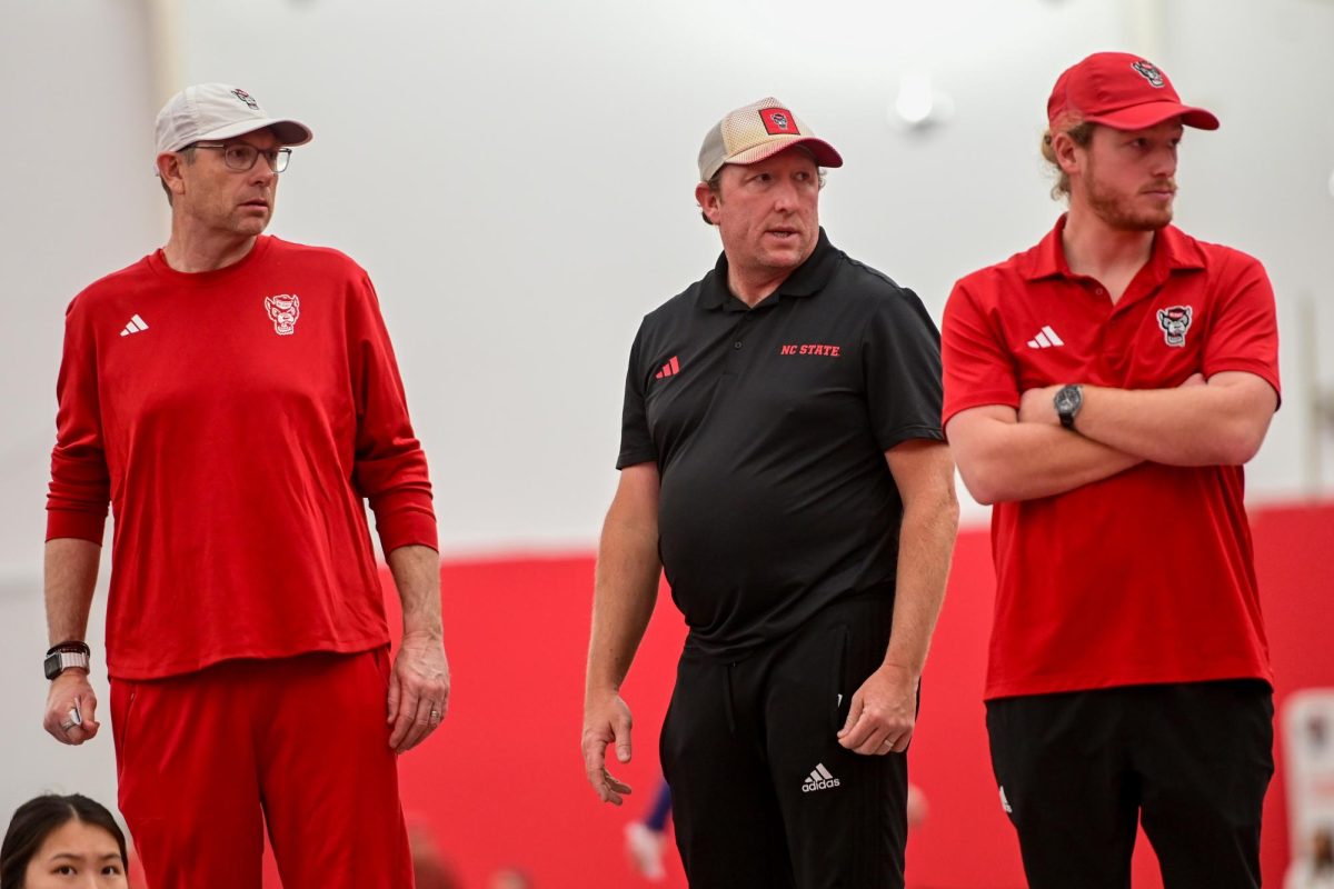 Head coach Kyle Spencer, assistant coach Cris James, and assistant coach Dennis Smith watch redshirt sophomore Jules Leroux's singles match against Duke at the J.W. Isenhour Tennis Center on Friday, Jan. 23, 2026.