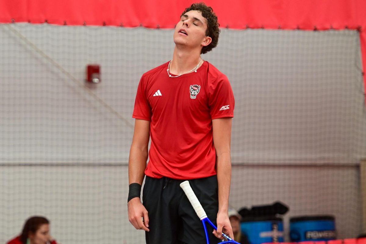 Redshirt sophomore Jules Leroux closes his eyes during his singles match against Duke at the J.W. Isenhour Tennis Center on Friday, Jan. 23, 2026. Leroux lost his singles match 3-6, 2-6. NC State fell to Duke 4-2.