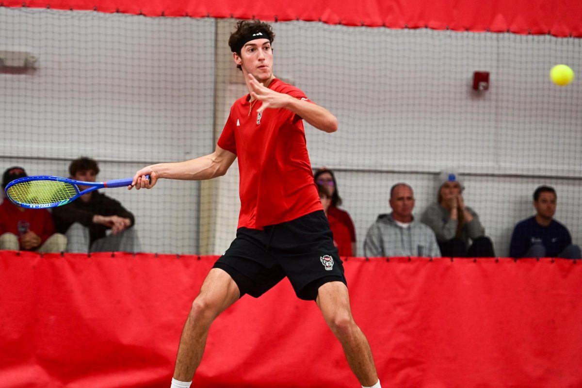 Redshirt sophomore William Manning returns the serve during his singles match against Duke at the J.W. Isenhour Tennis Center on Friday, Jan. 23, 2026. Manning won his singles match 5-7, 7-6 (3), 6-3. NC State fell to Duke 4-2.