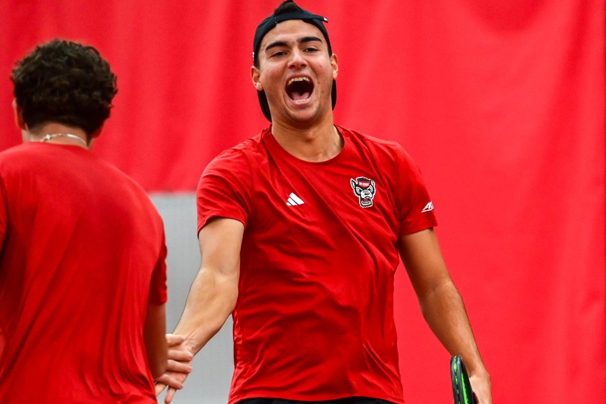 Freshman Darius Pop celebrates a point during his double match against Duke at the J.W. Isenhour Tennis Center on Friday, Jan. 23, 2026. Pop and Leroux won their doubles match 6-4. NC State fell to Duke 4-2.