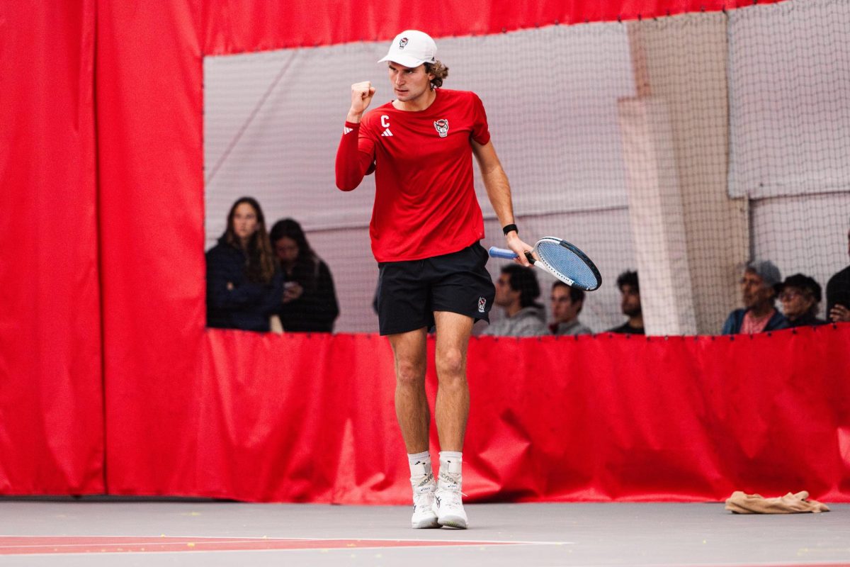 Senior Martin Borisiouk pumps his fist during the match against Duke University at the J.W. Isenhour Tennis Center on Friday, Jan. 23, 2026. Borisiouk lost his singles match 2-6, 4-6. The Wolfpack fell to the Blue Devils 4-2.