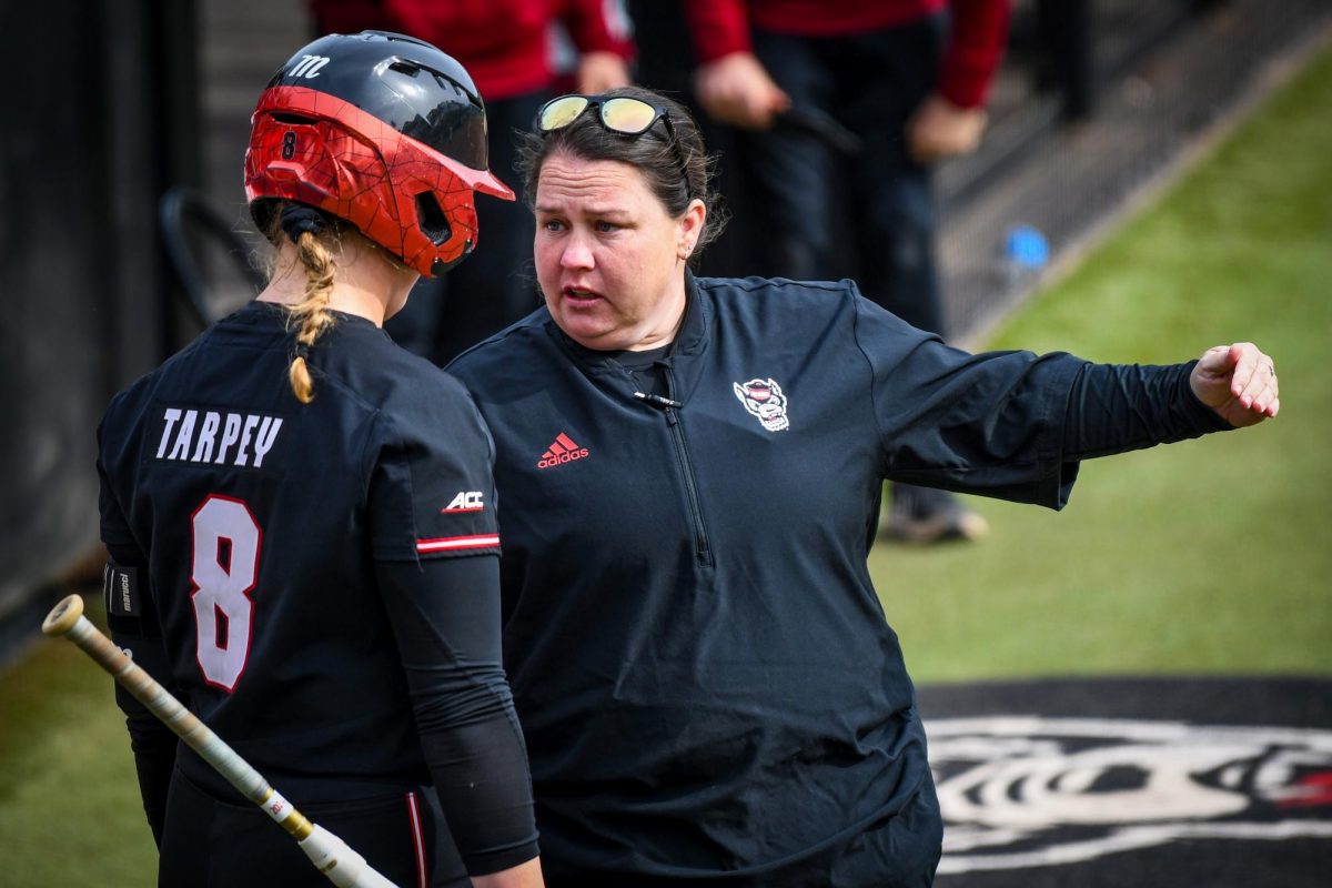 Head coach Lindsay Leftwich (right) instructs redshirt sophomore infielder Michele Tarpey (left) in the game against Elon at Dail Softball Stadium on Saturday, Feb. 17, 2024. NC State won the game 5-2.
