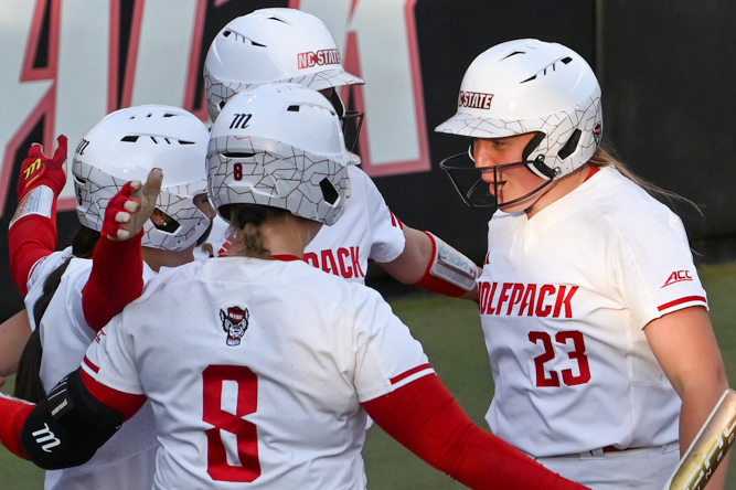 Junior catcher Hannah Church celebrates with teammates after hitting a home run during the game against UNC-Wilmington at Dail Softball Stadium on Saturday, March 1, 2025. Church had four RBIs. The Wolfpack defeated the Seahawks 14-1.