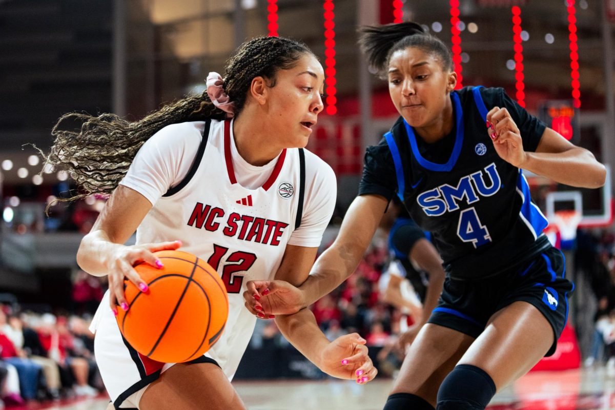 Junior forward Khamil Pierre drives to the lane during the game against SMU in Reynolds Coliseum on Sunday, Jan. 11, 2026. Pierre scored 14 points and had 12 rebounds. The Wolfpack defeated the Mustangs 90-54.