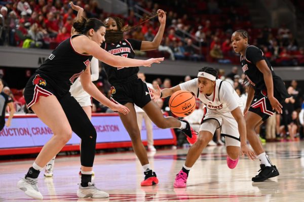 Junior guard Zoe Brooks attempts to drive the ball during the game against Louisville at Reynolds Coliseum on Sunday, Jan. 18, 2026. Brooks scored 19 points and made five assists. NC State fell to Louisville 88-80.