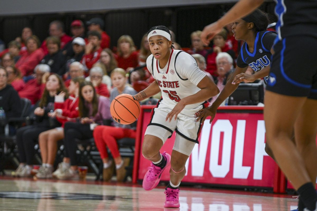 Junior guard Zoe Brooks dribbles the ball during the game against SMU in Reynolds Coliseum on Sunday, Jan. 11, 2026. The Wolfpack defeated the Mustangs 90-54.