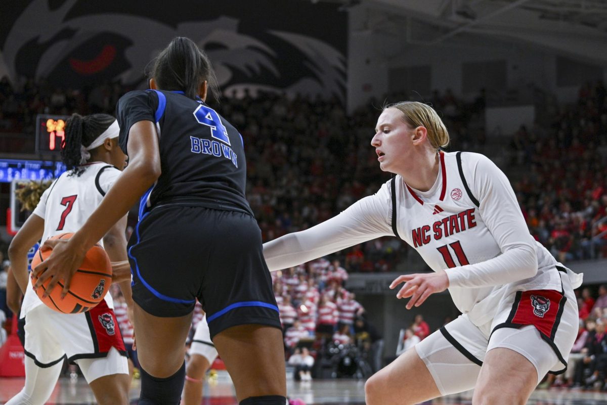 Junior forward Maddie Cox plays defense during the game against SMU in Reynolds Coliseum on Sunday, Jan. 11, 2026. The Wolfpack defeated the Mustangs 90-54.