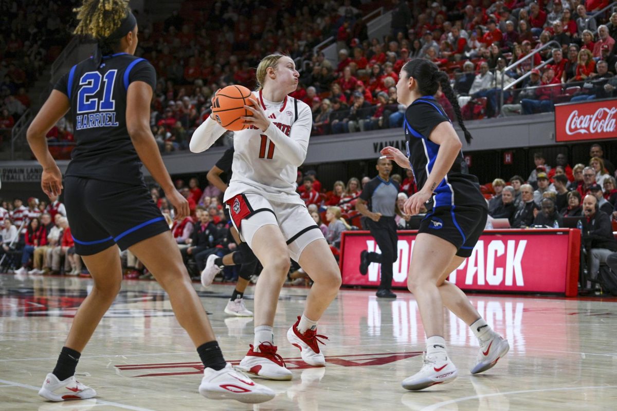 Junior forward Maddie Cox makes a pass during the game against SMU in Reynolds Coliseum on Sunday, Jan. 11, 2026. The Wolfpack defeated the Mustangs 90-54.