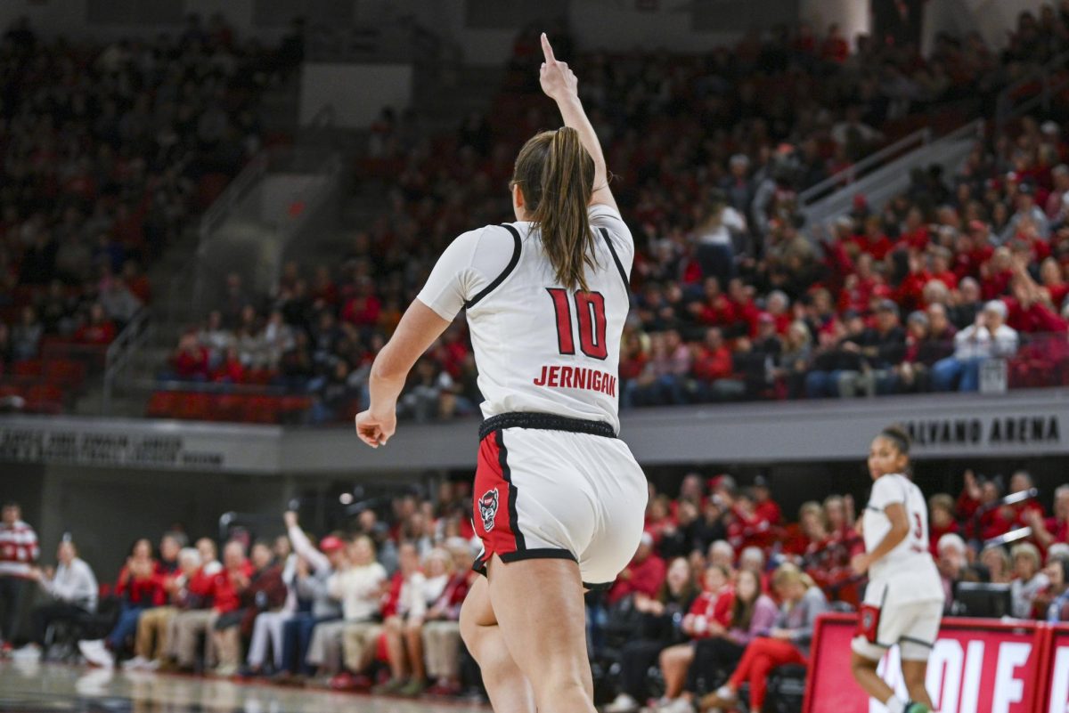 Freshman guard Adelaide Jernigan points to the passer after scoring a layup during the game against SMU in Reynolds Coliseum on Sunday, Jan. 11, 2026. The Wolfpack defeated the Mustangs 90-54.