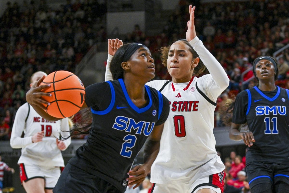 Sophomore guard Devyn Quigley plays some defense during the game against SMU in Reynolds Coliseum on Sunday, Jan. 11, 2026. The Wolfpack defeated the Mustangs 90-54.