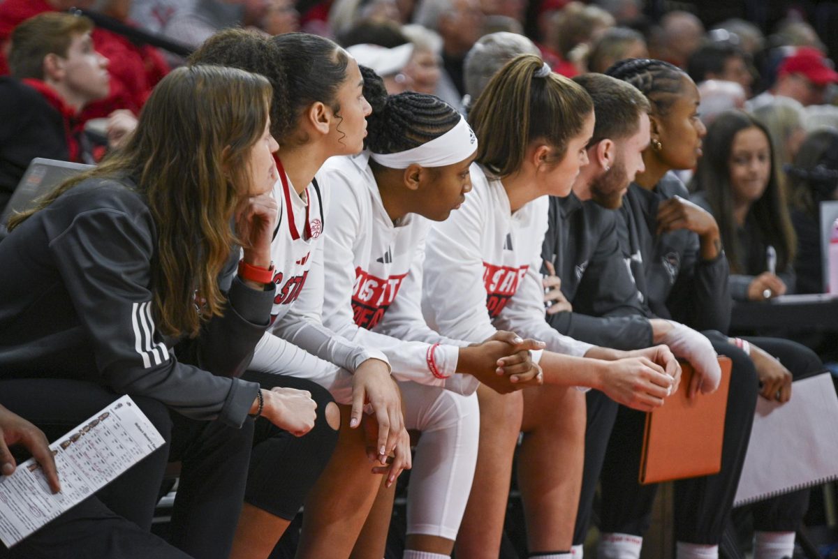 The bench focuses on the play during the game against Stanford at Reynolds Coliseum on Thursday, Jan. 1, 2026. The Wolfpack defeated the Cardinals 74-46.