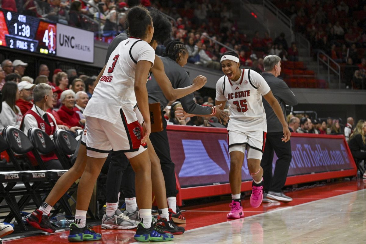 Junior guard Zoe Brooks celebrates with the bench during the game against Stanford at Reynolds Coliseum on Thursday, Jan. 1, 2026. Brooks scored a total of 18 points. The Wolfpack defeated the Cardinals 74-46.
